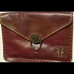 A Frye dark red / burgandy leather, lined clutch bag.
